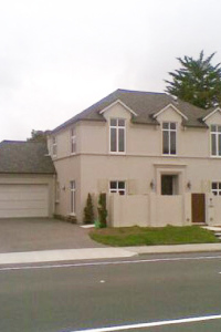 image of beige house with grey roof